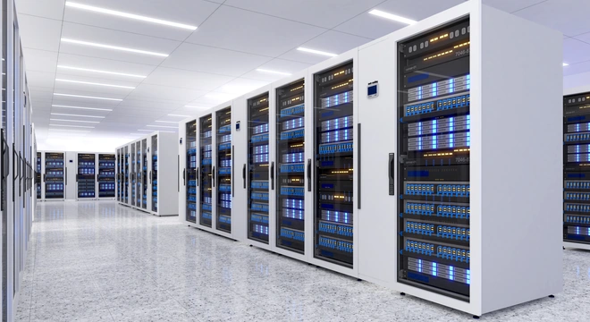 Modern data center with rows of white server racks
