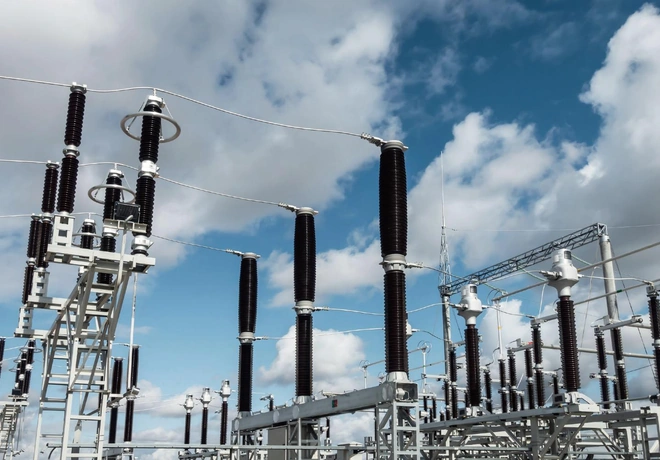 Row of 220 kV disconnectors and support insulators under overhead lines at the Shokparskaya substation