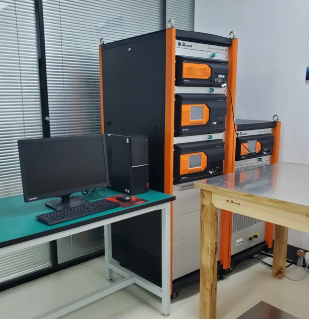 Electrical test cabinets and a computer workstation in the Sieyuan electrical performance laboratory