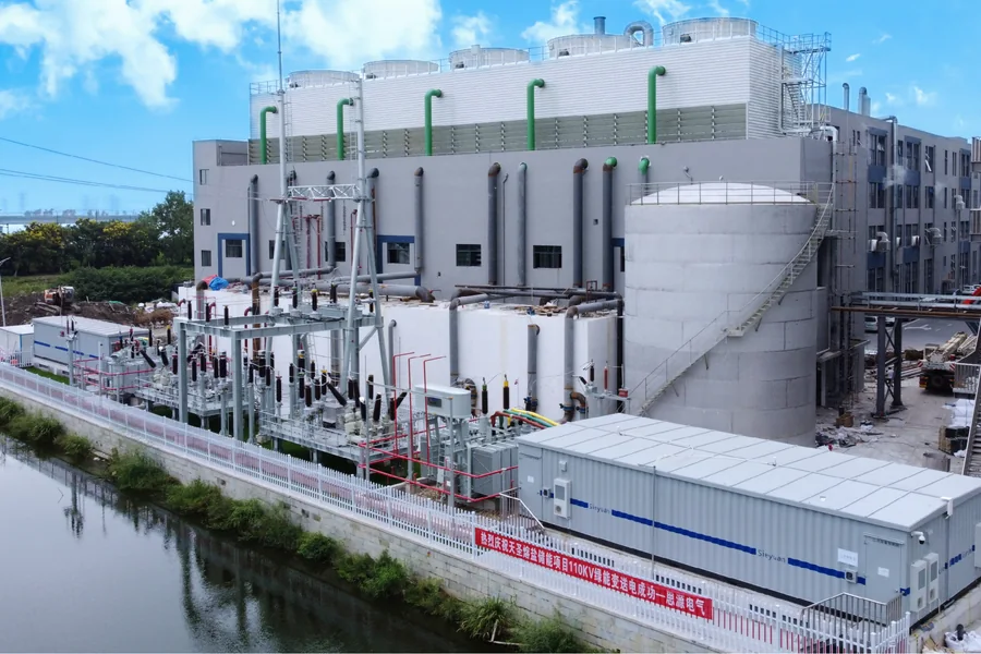 E-House module installed beside an outdoor substation at a large industrial plant
