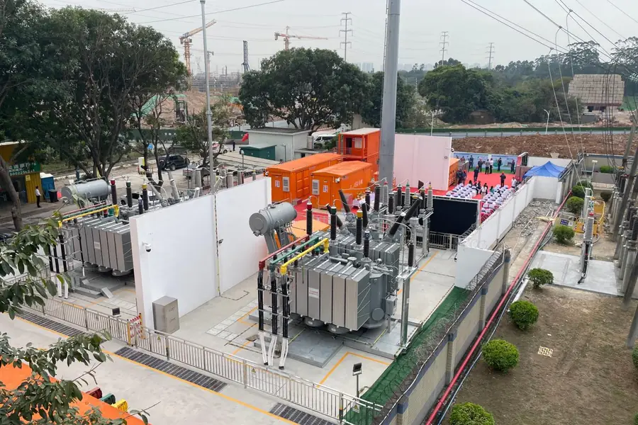 Mobile substation with transformer and equipment containers at a construction site